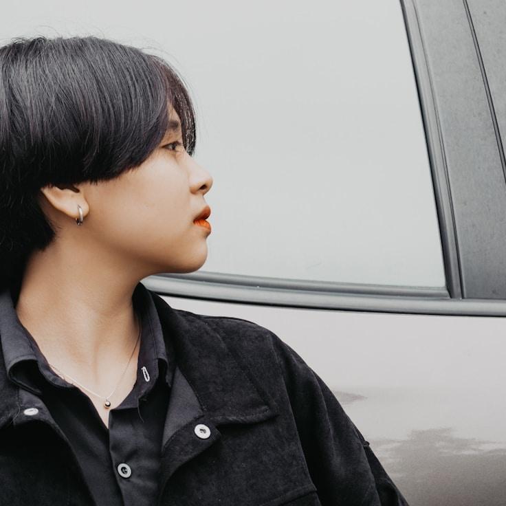 Mira Desai, Lead Design Curator at DenHarborQuay, reviewing corporate floral arrangements